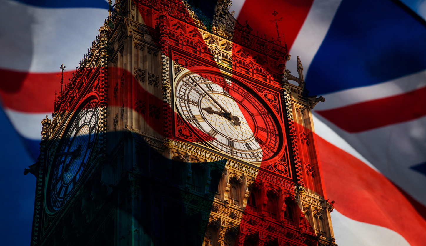 union jack flag and iconic Big Ben at the palace of Westminster, London