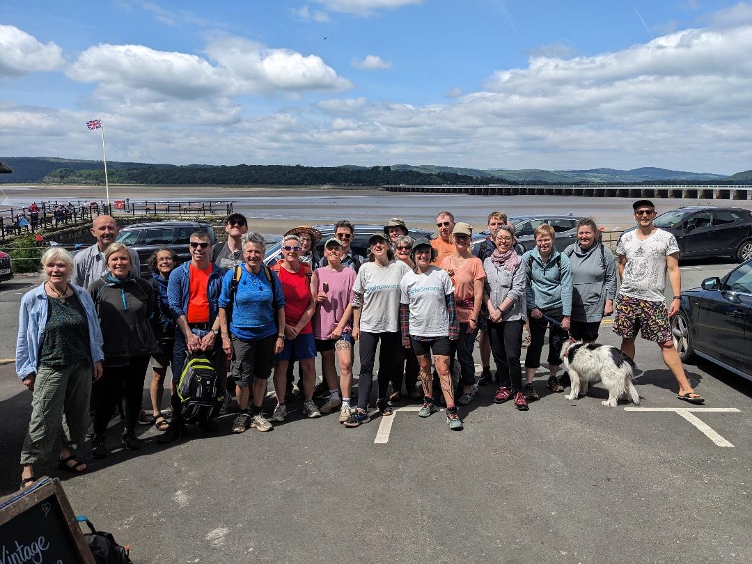 happy group of people ready to walk across Morecame bay in aid of LightAware